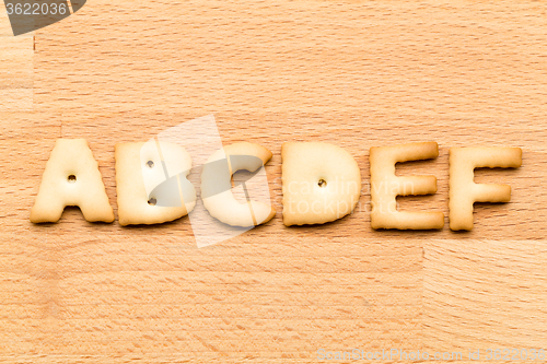 Image of Letter ABCDEF cookie over the wooden background