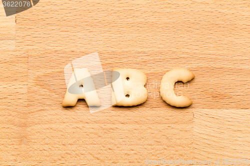 Image of Letter ABC cookie over the wooden background