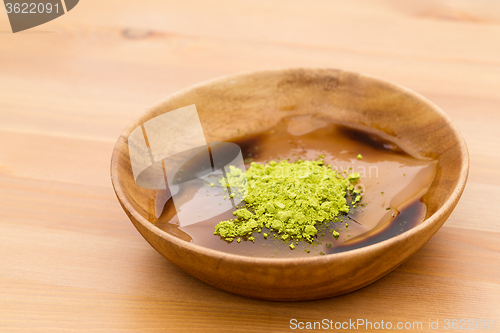 Image of Japanese dessert with green tea and black sugar