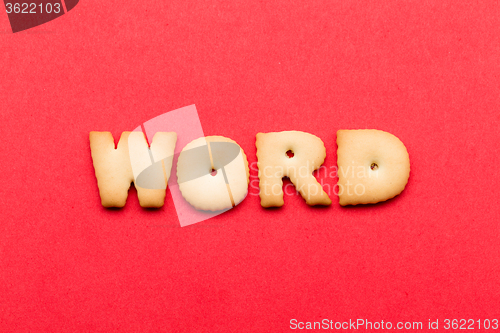 Image of Word biscuit over the red background