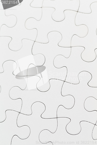 Image of White jigsaw puzzle pattern as a background