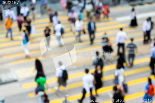 Image of Busy city people on zebra crossing street in Hong Kong