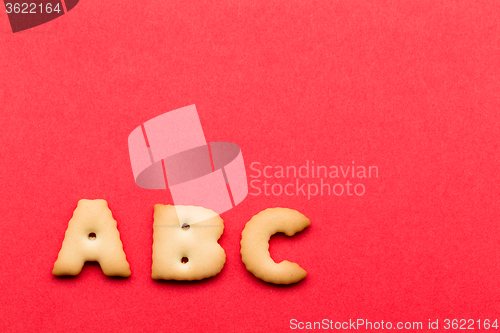 Image of ABC biscuit over the red background