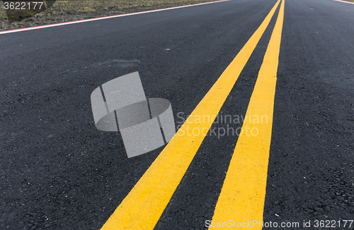 Image of Asphalt road with pair of yellow line