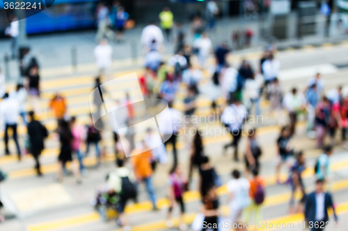 Image of City cross walk is littered with pedestrians