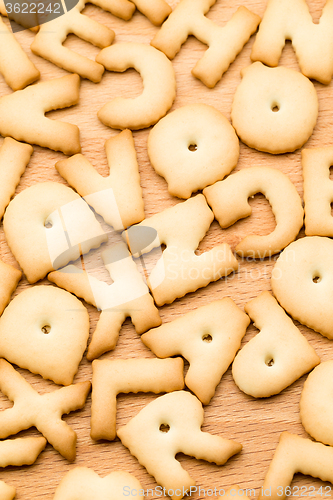 Image of Baked Letter biscuit over the wooden table