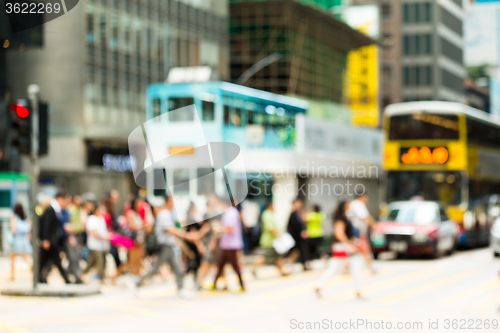 Image of Blurred view of the pedestrian crossing the road