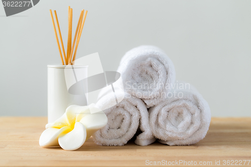 Image of Tropical flowers frangipani with Scented woods and white towel f