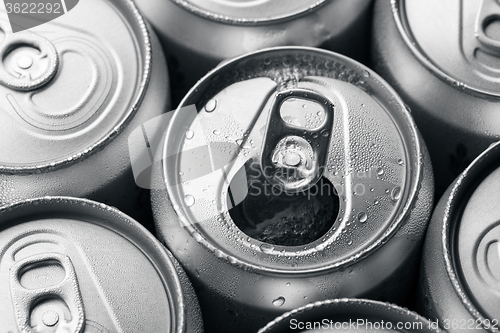 Image of Soda cans with one opened