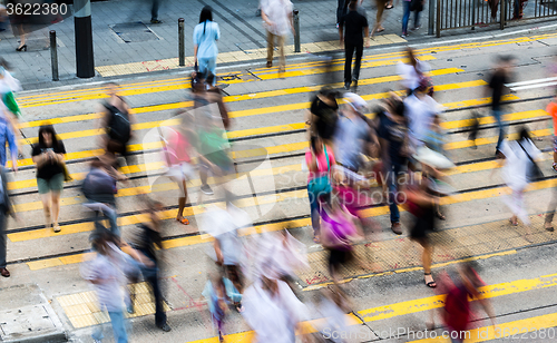 Image of Rush Hour with crowded people crossing the road