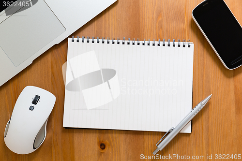 Image of Office table with empty handbook for advertising