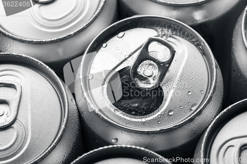 Image of Opened and closed canned drinks