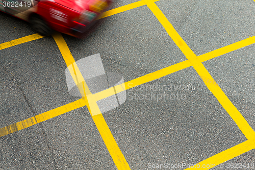 Image of Red Hong Kong Taxi on road