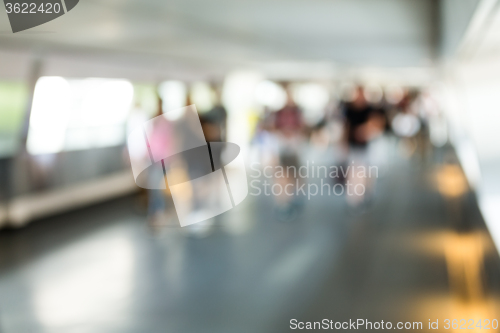 Image of Crowded of people in corridor with blur background