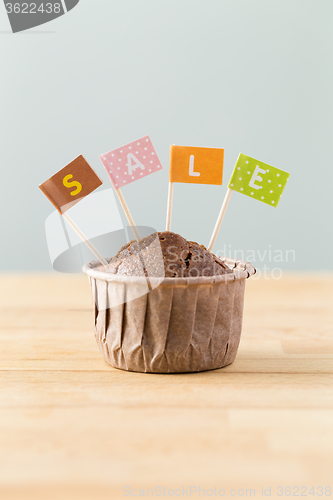 Image of Flag on muffin with a word sale