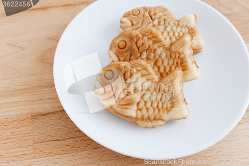 Image of Japanese confectionery taiyaki fish cake wagashi on plate on tab