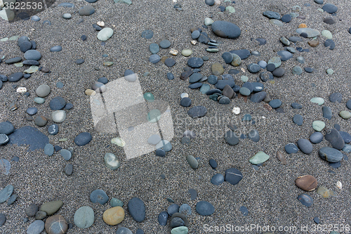 Image of Different gray stones pebble beach