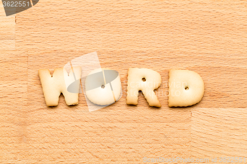 Image of Letter word cookie over the wooden background