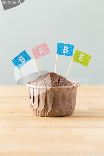 Image of Flag on muffin with a word babe