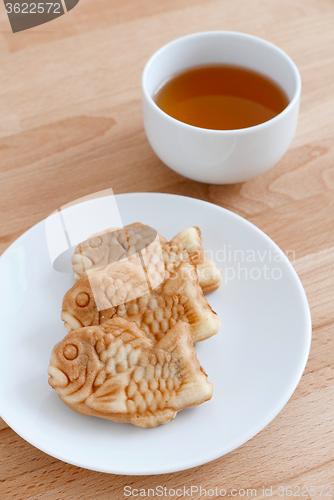 Image of Japanese fish-shaped cake with a cup of tea