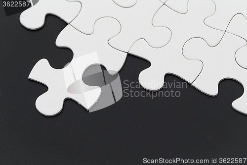 Image of Puzzle over black background