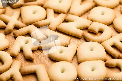 Image of Baked letter cookie over the wooden table