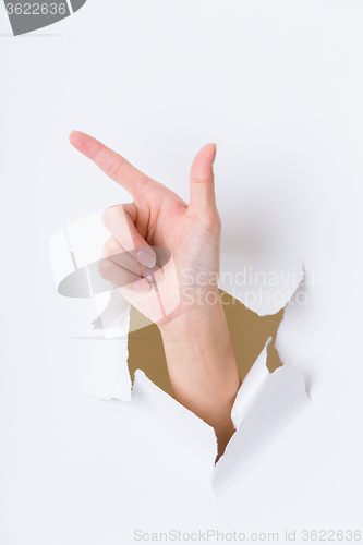 Image of Tick gesture breaking through the paper wall