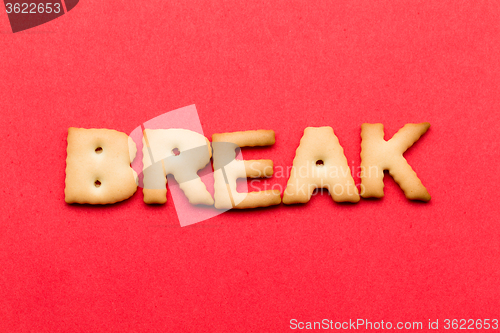 Image of Word break cookie over the red background