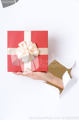 Image of Paper though the gift box
