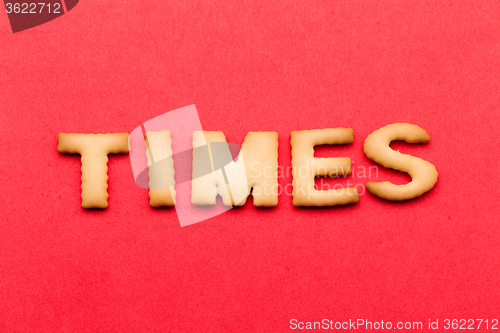 Image of Word times cookie over the red background