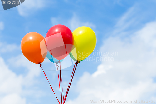 Image of Color balloons with blue sky