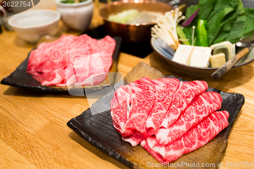 Image of Fresh Beef and pork slices for Shabu shabu and Sukiyaki
