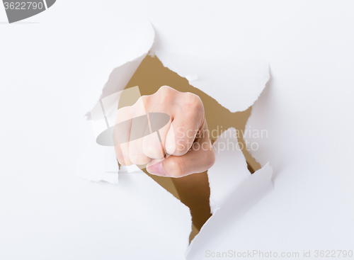 Image of Punch break through the paper wall