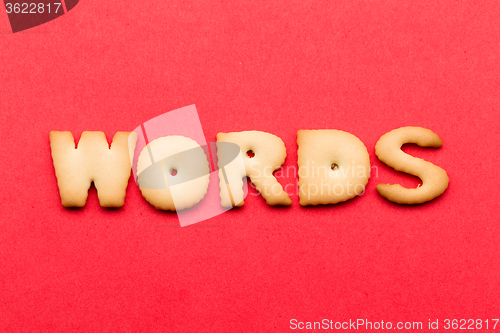 Image of Words biscuit over the red background