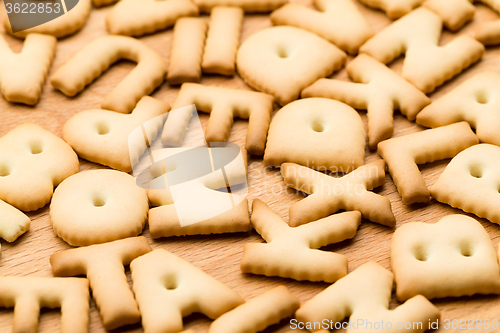 Image of Baked text cookie over the wooden table