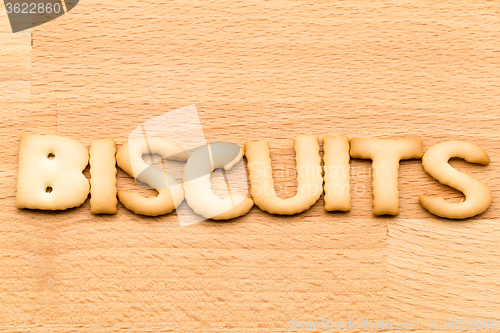 Image of Word biscuits over the wooden background