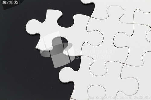 Image of Puzzle over black background