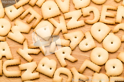 Image of Baked word cookie over wooden table