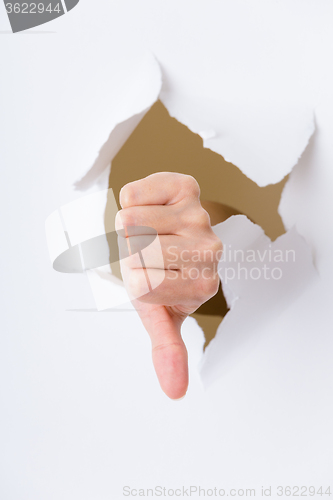 Image of Thumbs down sign from paper hole