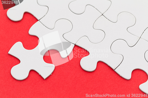 Image of Jigsaw puzzle over the red background