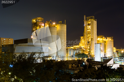 Image of coal power station and cement plant at night