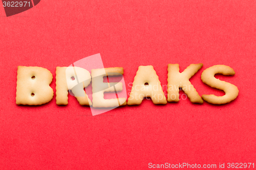 Image of Word breaks biscuit over the red background