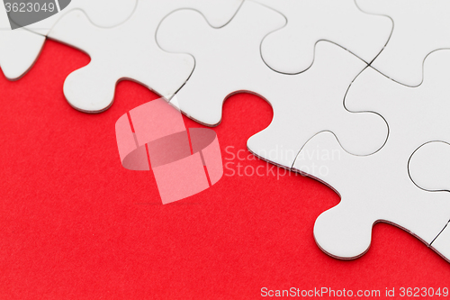 Image of Missing jigsaw puzzle piece with light glow