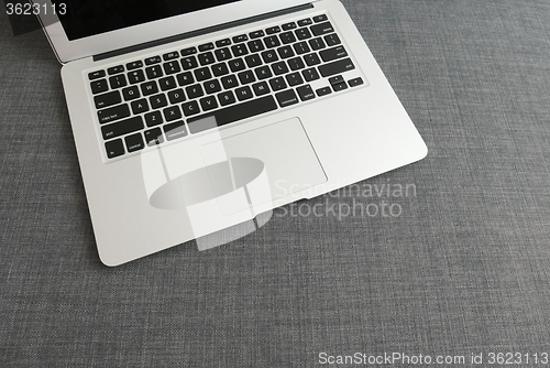 Image of Laptop on the blue cloth background