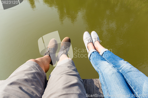 Image of Couple legs on water lake