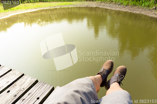 Image of Man legs with lake