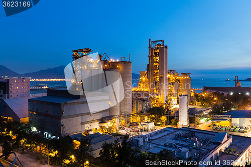 Image of Cement factory during sunset