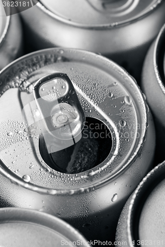 Image of Opened and closed canned drinks