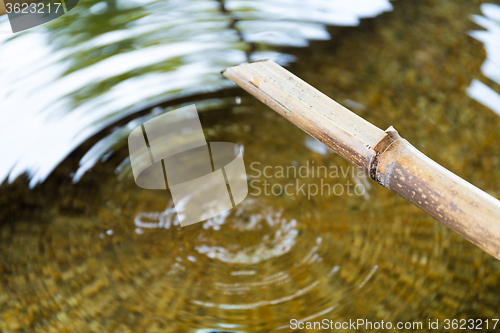 Image of Bamboo fountain with water wave