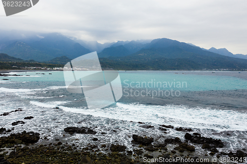 Image of Coastline and hill